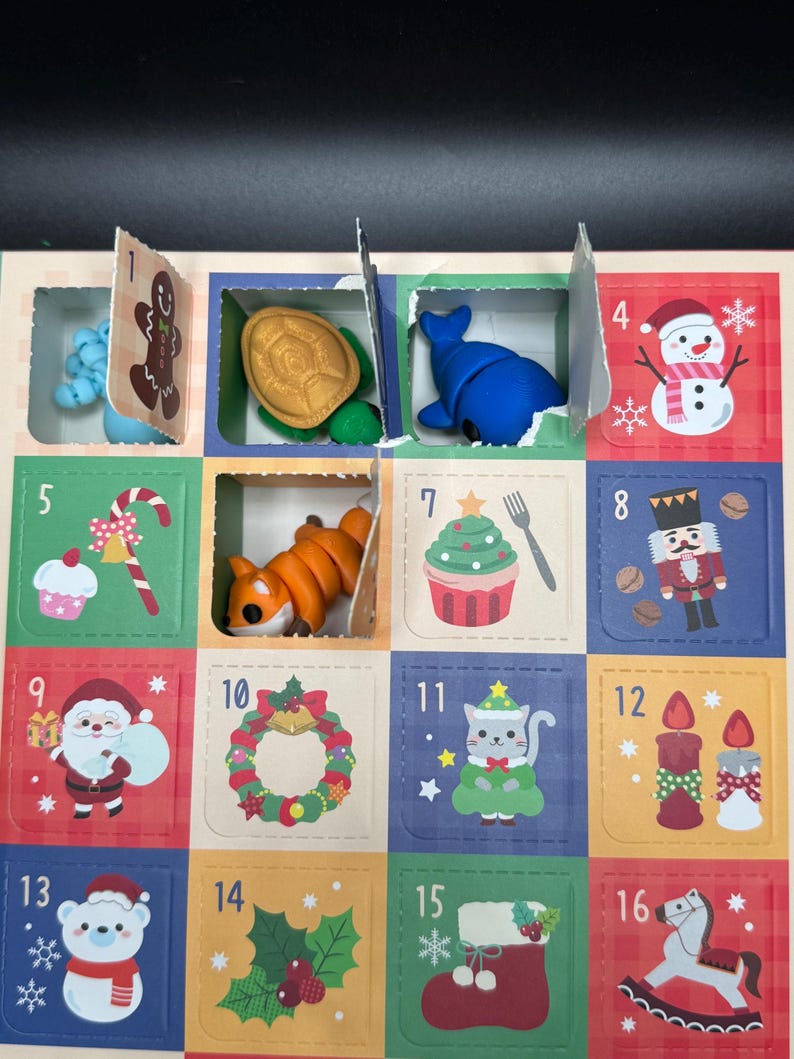 May include: Advent calendar with numbered compartments, each revealing a small toy or decoration. Includes a gingerbread man, turtle, whale, snowman, fox, cupcake, nutcracker, Santa, wreath, cat, candles, polar bear, holly, stocking, and rocking horse.