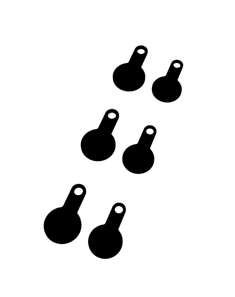 May include: Six black, abstract shapes with a circular base and a small, rounded handle with a white circle at the end. The shapes are arranged diagonally on a white background.