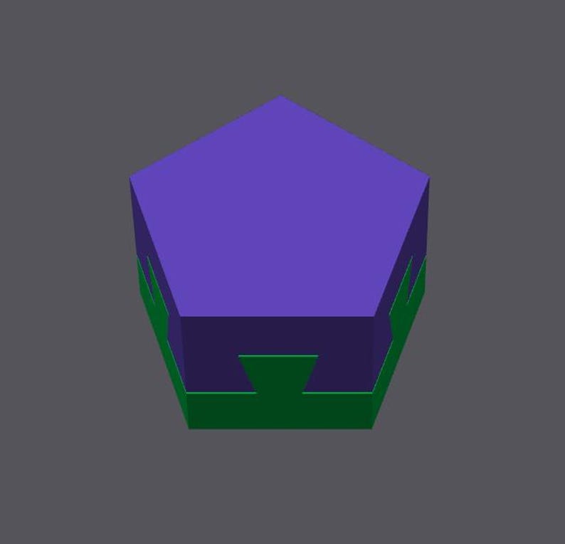 May include: A purple pentagonal prism with a green base and a green top. The prism has a flat top and bottom.