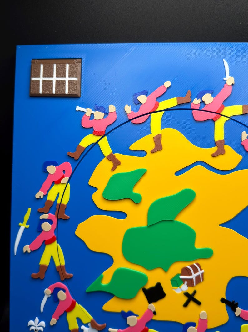 May include: A colorful, 3D-printed map with a blue background and a yellow landmass. Figures in pink shirts and yellow pants are depicted in action, some with swords. Green islands and a treasure chest are also visible.