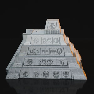 May include: A white, 3D printed model of a pyramid with intricate carvings and symbols. The pyramid has multiple levels and is decorated with a variety of designs, including circles, hands, and faces.