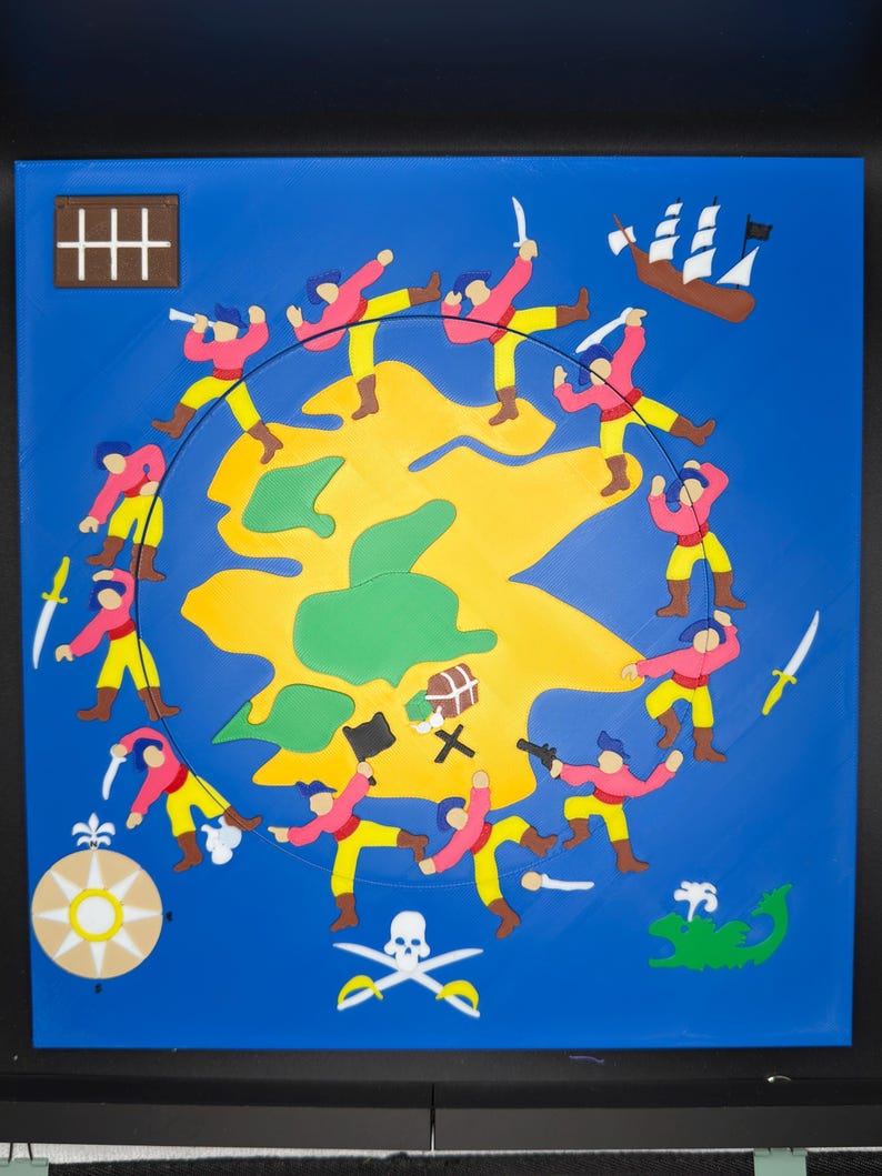 May include: A framed, colorful pirate-themed artwork. The artwork features a yellow island surrounded by a blue background. Around the island are cartoon pirates in pink shirts and yellow pants. A treasure chest, skull and crossbones, and a ship are also depicted.