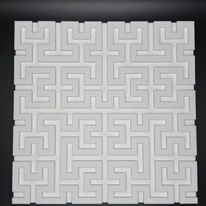 May include: White 3D printed wall panel with a geometric maze pattern. The panel is made of a smooth, white plastic and has a raised design.