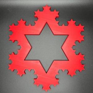 May include: A red, 3D printed, six-pointed star with a fractal design. The star is made up of many smaller triangles and has a hollow center.