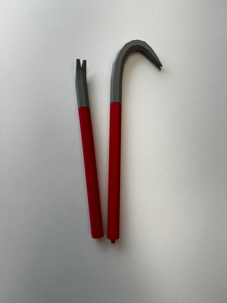 May include: Two red-handled pry bars with gray metal heads. One pry bar has a curved head and the other has a straight head.