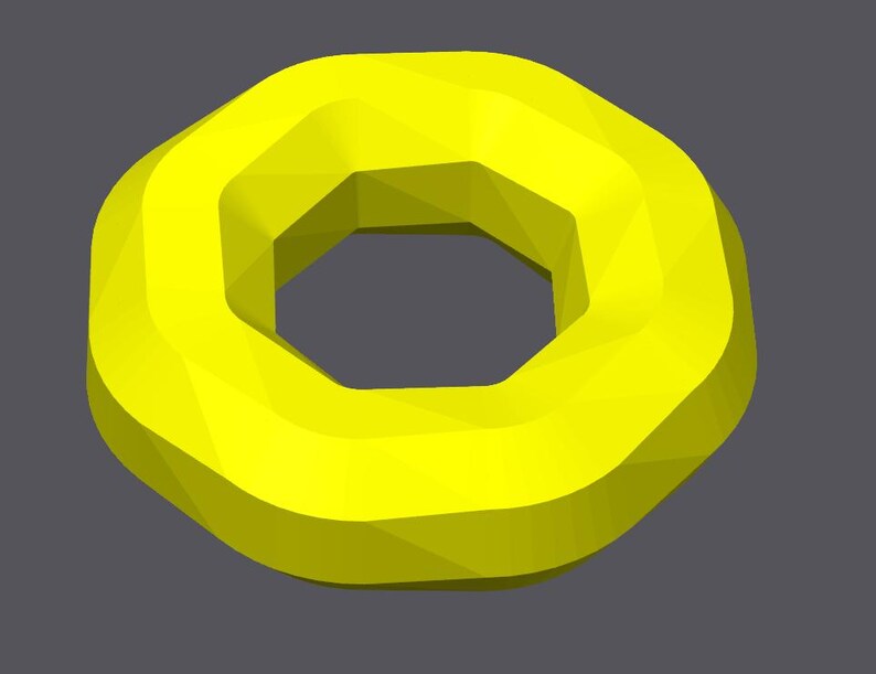 May include: A bright yellow geometric donut shape with a hexagonal hole in the center.