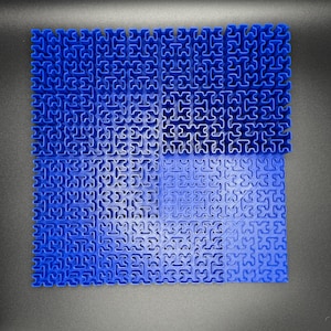 May include: A blue interlocking puzzle mat made of plastic. The mat is made up of small squares that fit together to create a larger surface.