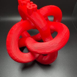 May include: A red 3D printed knot sculpture with the number "88" printed on the top.