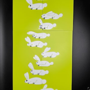 May include: A yellow background with a series of white rabbit silhouettes in various poses, creating a visual sequence of movement.