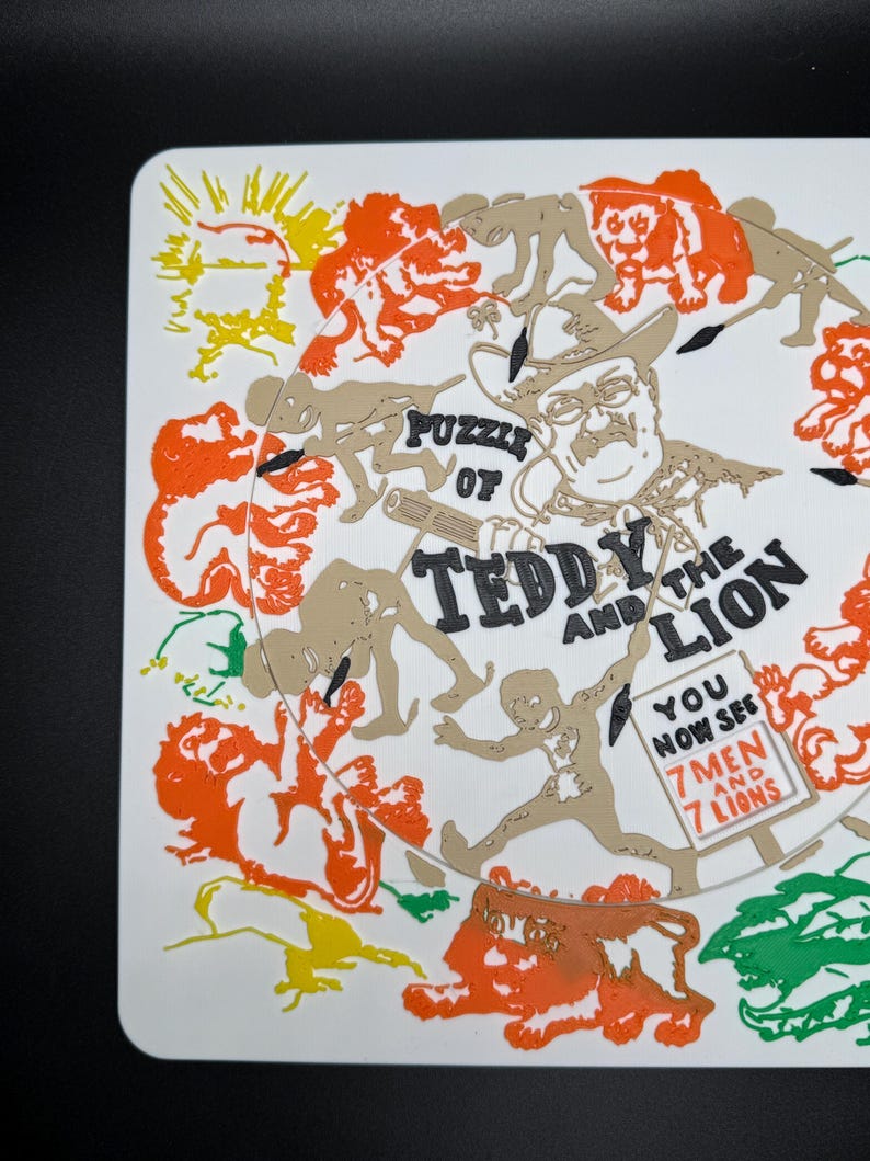 May include: A white square coaster with a colorful illustration. The design features a portrait of a man in a cowboy hat, surrounded by figures and lions. Text reads "Puzzle of Teddy and the Lion" and "You now see 7 men and 7 lions."