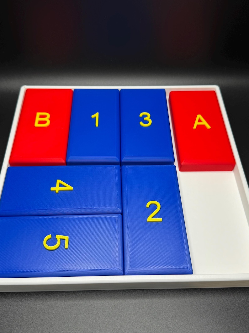 May include: A white tray with blue and red tiles. The blue tiles have the numbers 1, 3, 4, 5, and 2 printed on them in yellow. The red tiles have the letters B and A printed on them in yellow.