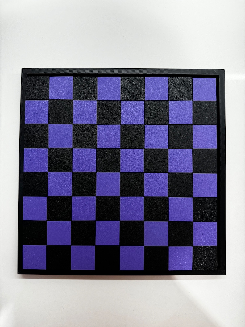 May include: A black and purple checkerboard game board with a black frame.