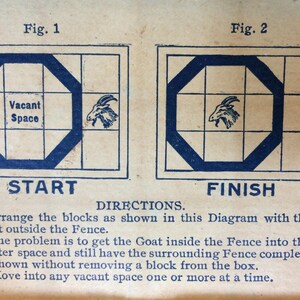 May include: A vintage game board with a goat and a fence. The goal of the game is to move the goat inside the fence without removing any pieces. The game board is labeled "Start" and "Finish".
