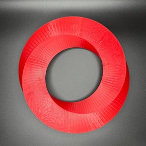 May include: A red, 3D printed, Mobius strip shaped ring. The ring is made of plastic and has a smooth, glossy finish.