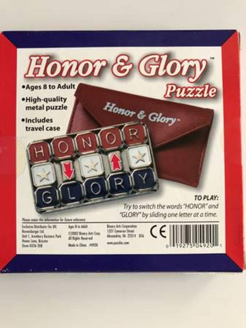 May include: A boxed "Honor & Glory" puzzle with a red, white, and blue color scheme. The puzzle includes a metal puzzle and a travel case. The puzzle's objective is to switch the words "HONOR" and "GLORY" by sliding one letter at a time.