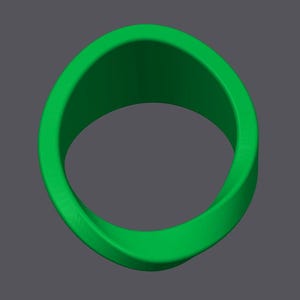 K&ouml;nnte beinhalten: Ein leuchtend gr&uuml;ner Ring in Form eines M&ouml;biusbandes. Der Ring hat eine glatte, durchgehende Oberfl&auml;che und ein dreidimensionales Design. Der Ring ist vor einem grauen Hintergrund platziert.