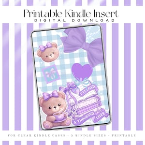 May include: A digital download for a Kindle insert featuring a cute teddy bear with a purple bow, a stack of books, and a heart. The design includes the text "Printable Kindle Insert" and "Digital Download". The background has a light blue gingham pattern.