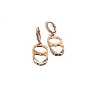 May include: A pair of gold earrings with a heart-shaped cutout and small clear stones. The earrings are in the shape of a pull tab from a can.