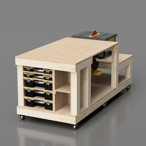May include: A wooden workbench with a table saw mounted on top. The workbench has a storage shelf with drawers and is on wheels. The table saw has a black blade and a yellow and black guard.