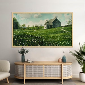 May include: A framed painting of a rural landscape with a white farmhouse and green fields. The farmhouse has a gray roof and a white picket fence. The fields are covered in green grass and white flowers.