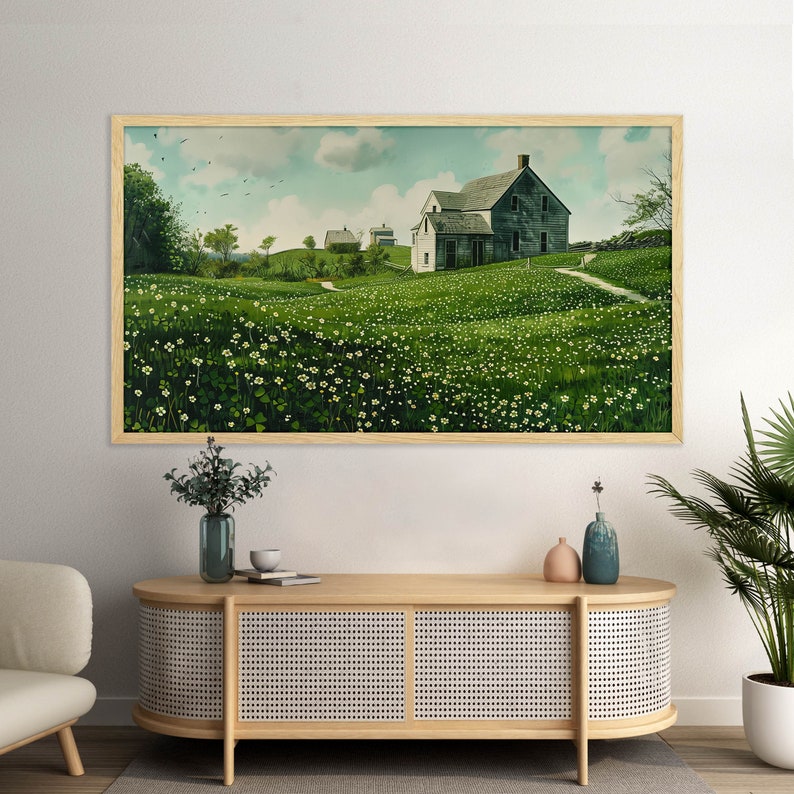 May include: A framed painting of a rural landscape with a white farmhouse and green fields. The farmhouse has a gray roof and a white picket fence. The fields are covered in green grass and white flowers.