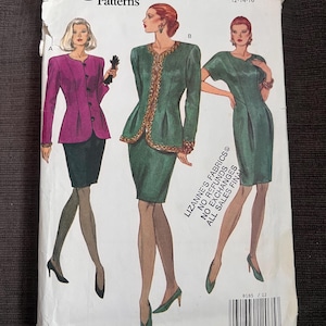 May include: Vogue Patterns sewing pattern envelope featuring illustrations of women's suits and dresses. The envelope includes the text "Vogue Patterns" and "LIZANNE'S FABRICS". The size range is 12-14-16.