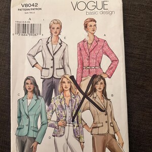 May include: A Vogue Basic Design sewing pattern envelope V8042 featuring illustrations of five different blazer styles labeled A through E. The white paper envelope displays various jacket designs including solid colors, a floral print, and a striped pattern.