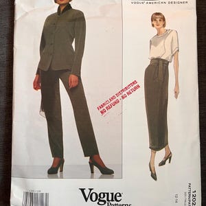 May include: A Vogue Patterns sewing pattern designed by Calvin Klein. The pattern shows a two-piece suit and a skirt and top outfit. The pattern number is 1202, and the size range is 12-14.