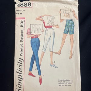 May include: Vintage Simplicity printed pattern envelope. The envelope features illustrations of three different trousers styles. The text on the envelope includes the pattern number 4886, waist and hip measurements, and the price.