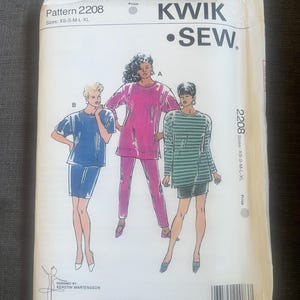 May include: A vintage Kwik Sew sewing pattern packet, Pattern 2208, featuring illustrations of three different outfits. The packet is white with black text and illustrations. The sizes are XS-S-M-L-XL. The designer is Kerstin Martensson.