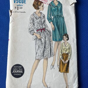 May include: Vintage Vogue pattern envelope with illustrations of three dresses. The envelope is off-white with the Vogue logo, pattern details, and the text "EDITORS' Ladies' Home JOURNAL CHOICE". The bust size is 86 cm, and the hip size is 91 cm.