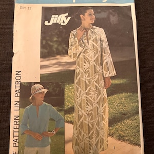 May include: Simplicity sewing pattern 7521, size 12. The pattern features a woman in a long, flowing dress with a botanical print. The pattern also includes a smaller image of a top and pants. The text "Jiffy" is visible.