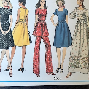May include: A sewing pattern envelope labeled 2555 featuring illustrations of five different outfits: a black polka dot dress, a yellow sleeveless dress, a red floral tunic and pants set, a blue dress, and a long white dress with a paisley print.