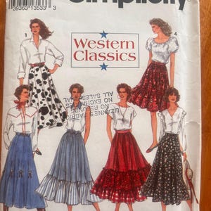 May include: Simplicity sewing pattern envelope with Western Classics designs. The envelope shows illustrations of different skirt and blouse combinations, including a cow-print skirt and a red gingham skirt. The text "Western Classics" is clearly visible.