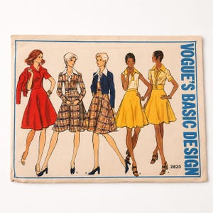 May include: Vintage Vogue's Basic Design sewing pattern featuring five illustrated women's fashion designs. The designs include dresses and jackets in various colors and patterns. The pattern number 2823 is visible on the bottom right.