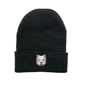 May include: A black knitted beanie with a white and grey embroidered dog face on the front.