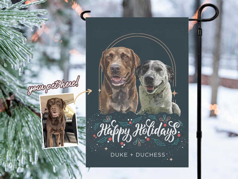 May include: A personalized garden flag featuring two dogs with a holiday theme. The flag has a dark teal background with the words "Happy Holidays" in script, along with the names "DUKE + DUCHESS". An inset photo shows a brown dog.