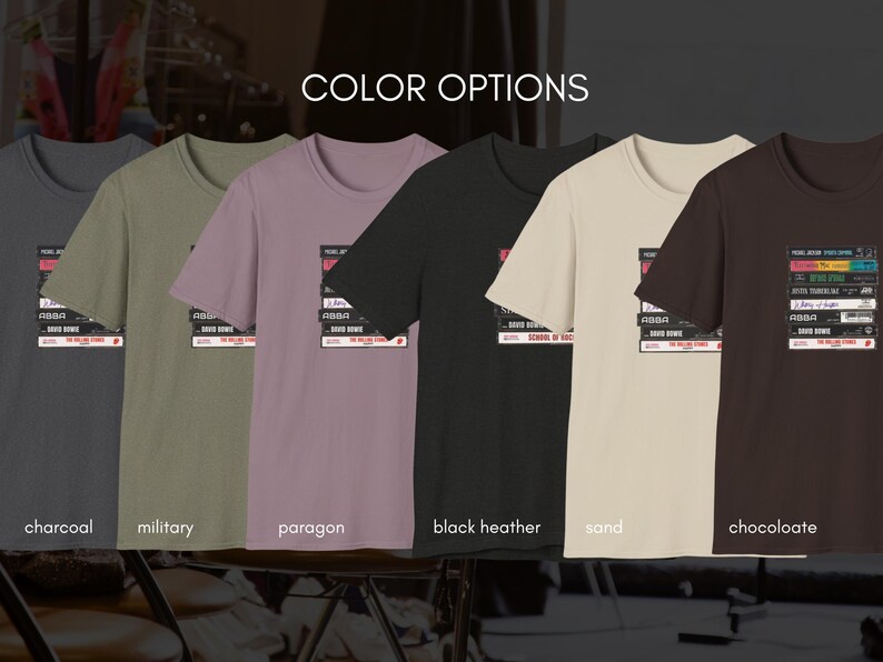 May include: A selection of t-shirts in various colors, each featuring a graphic of a stack of cassette tapes with the text "The Rolling Stones" and "School of Rock". The colors include charcoal, military, paragon, black heather, sand, and chocolate.