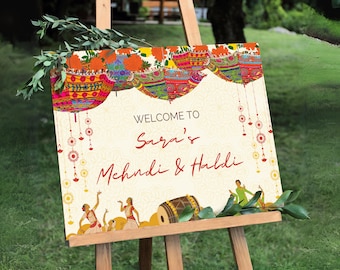 May include: A colorful welcome sign for a Mehndi & Haldi celebration. The sign features a floral design with hanging lanterns, a drum, and dancers. The text reads "Welcome to Sara's Mehndi & Haldi".