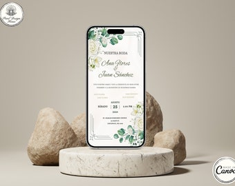 May include: A white and green wedding invitation on a smartphone screen. The invitation features a floral design with white roses and green leaves. The text on the invitation reads "Nuestra Boda" and includes the names "Ana Flores & Juan Sánchez". The date and time of the wedding are also included: "Sábado 25 Agosto 2024 | 2:00 PM".