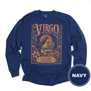 Navy long-sleeve shirt with "Virgo" and astrological art, showing a woman and text.