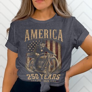 Dark t-shirt with American flag, motorcycle, and "America 250 Years" text.
