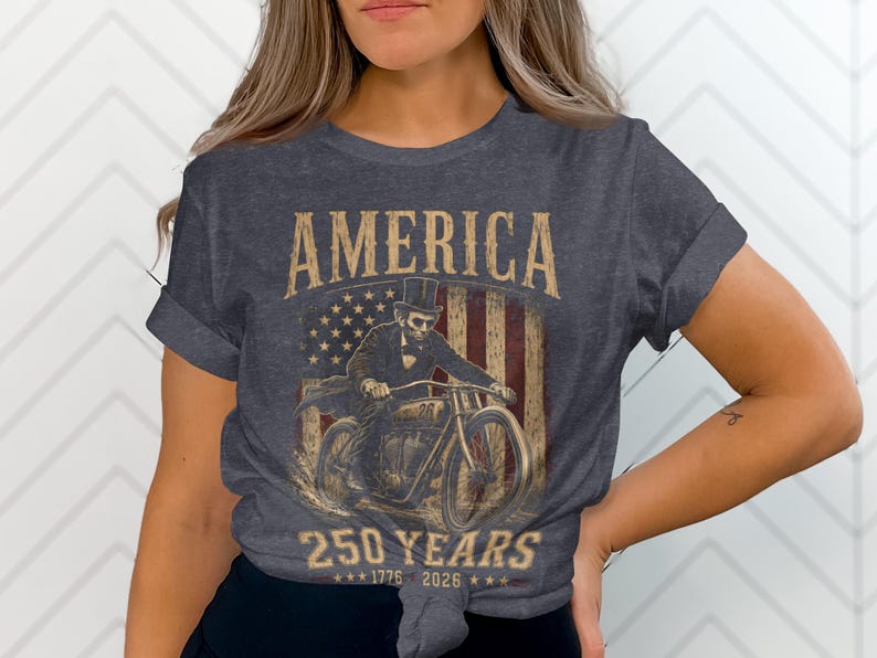 Dark t-shirt with American flag, motorcycle, and "America 250 Years" text.