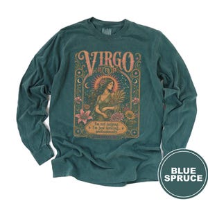 Virgo zodiac graphic on a teal long-sleeve t-shirt with text.