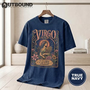 Dark blue t-shirt with "Virgo" and astrological graphic and text.