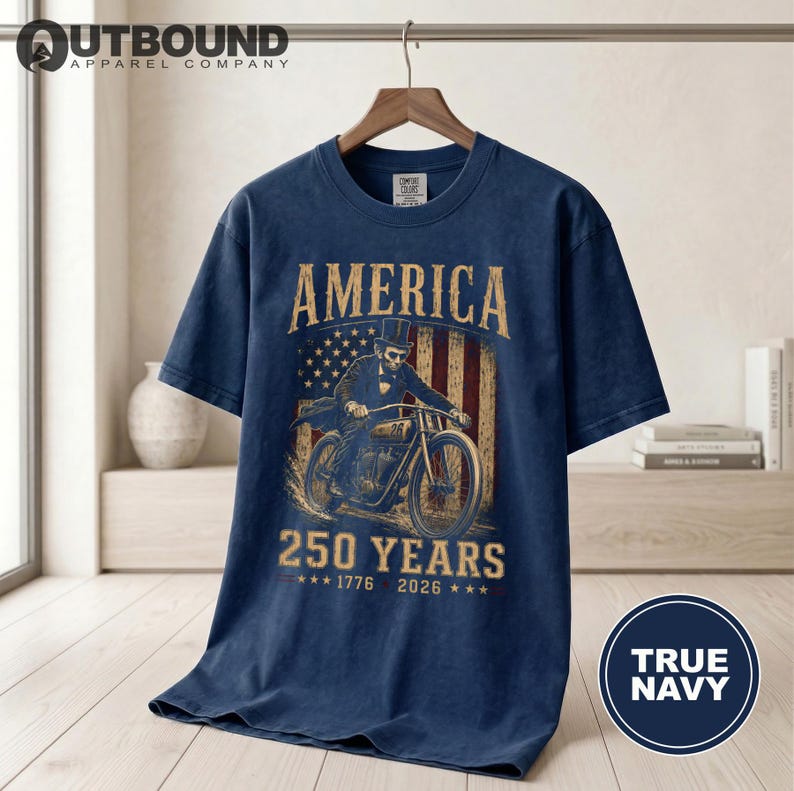 T-shirt featuring vintage motorcycle, American flag, and "America 250 Years 1776-2026".