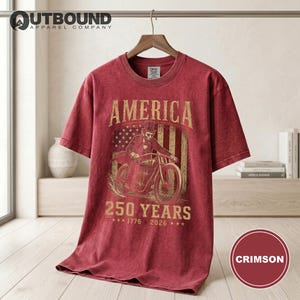 Crimson t-shirt with America 250 Years and bicentennial dates graphic.