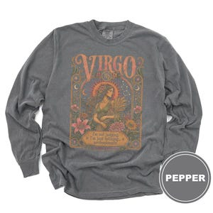 Grey long-sleeve shirt with "Virgo" zodiac graphic, a woman, and text.