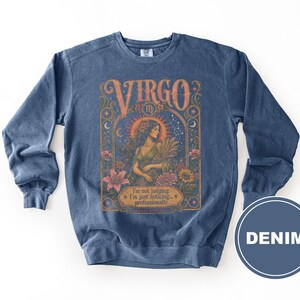 Navy blue sweatshirt with "Virgo" zodiac design and "I'm not judging. I'm just noticing..." text.