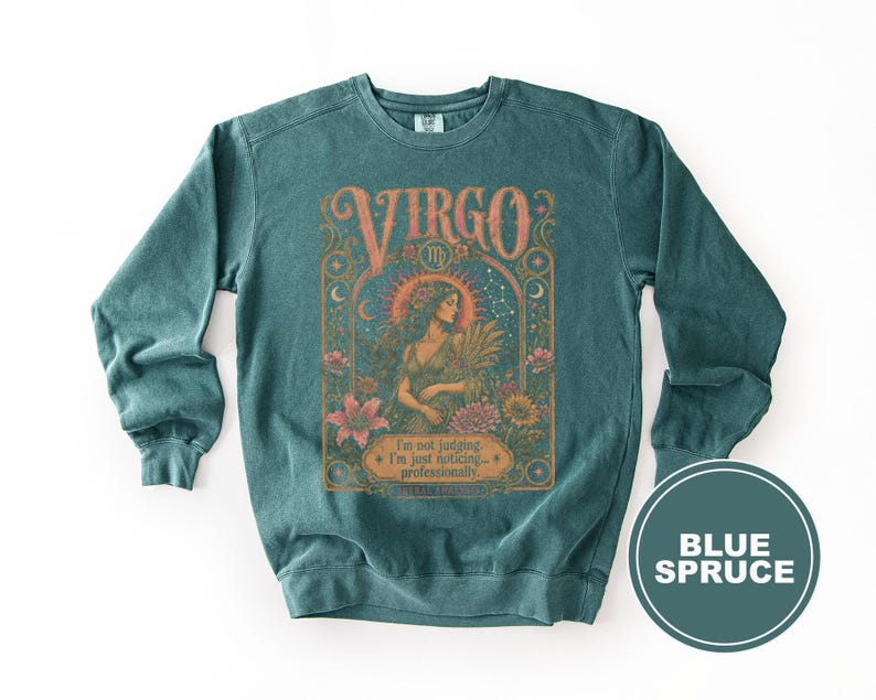 Teal sweatshirt with "Virgo" design, a woman holding wheat, and text.